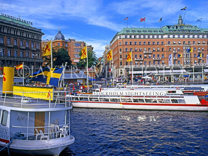 SWEDEN, Stockholm, City view at Stromkajen with pleasure boats and Grand Hotel, SWE112JPL