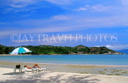 THAILAND, Ko Samui Island, coast, and sunbather with umbrella on beach, THA1963JPL