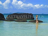 THAILAND, Koh Mak Island, woman (tourist) paddling in clear water, THA1957JPL