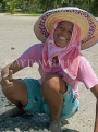 THAILAND, Koh Phangan Island, worker digging for cockles, posing, THA2020JPL