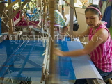 THAILAND, Korat, worker weaving silk, THA2063JPL