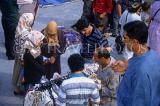 TURKEY, Istanbul, market scene, cloths stall and women in traditional dress, TUR367JPL