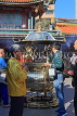 Taiwan, TAIPEI, Lungshan Temple, worshippers by incense burner censer, TAW670JPL